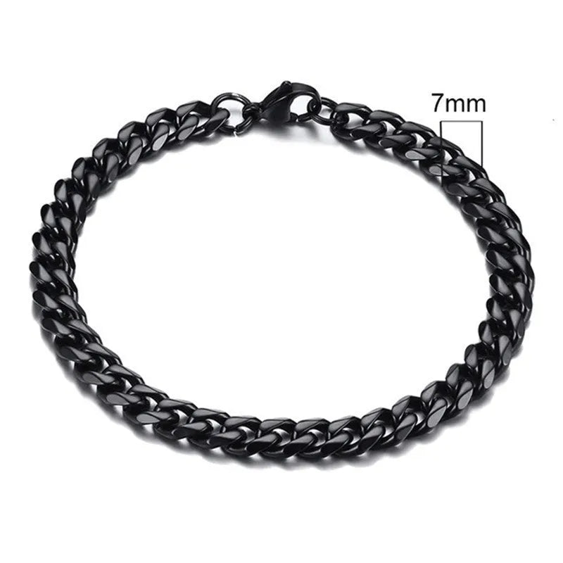 Six-sided geometric Cuban link metal bracelet in gold, black, and steel colour finishes.