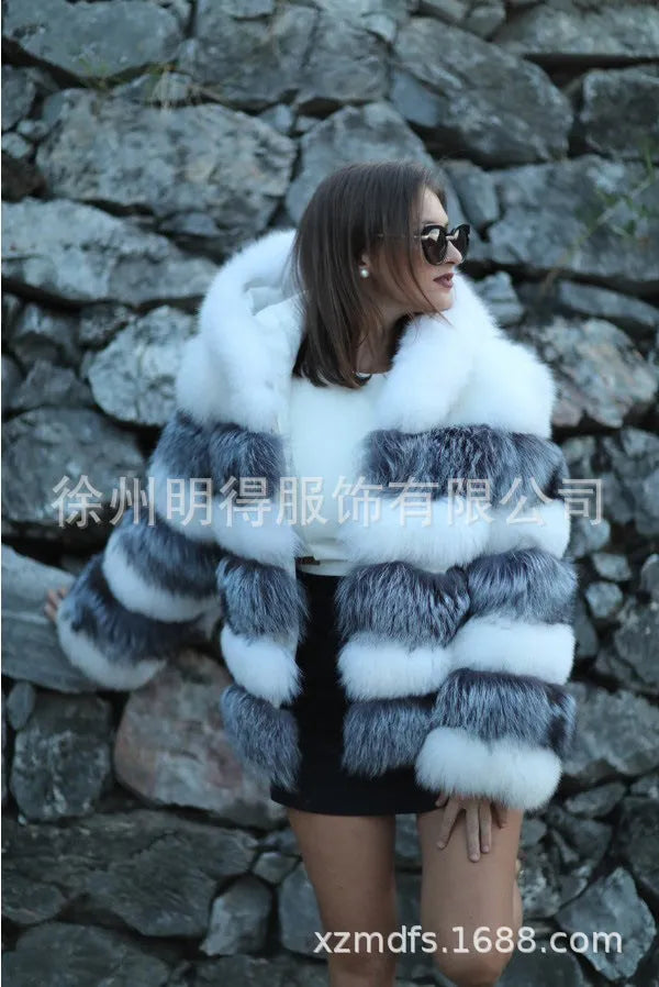 Women's loose artificial fur coat with hood in brown colour on mannequin