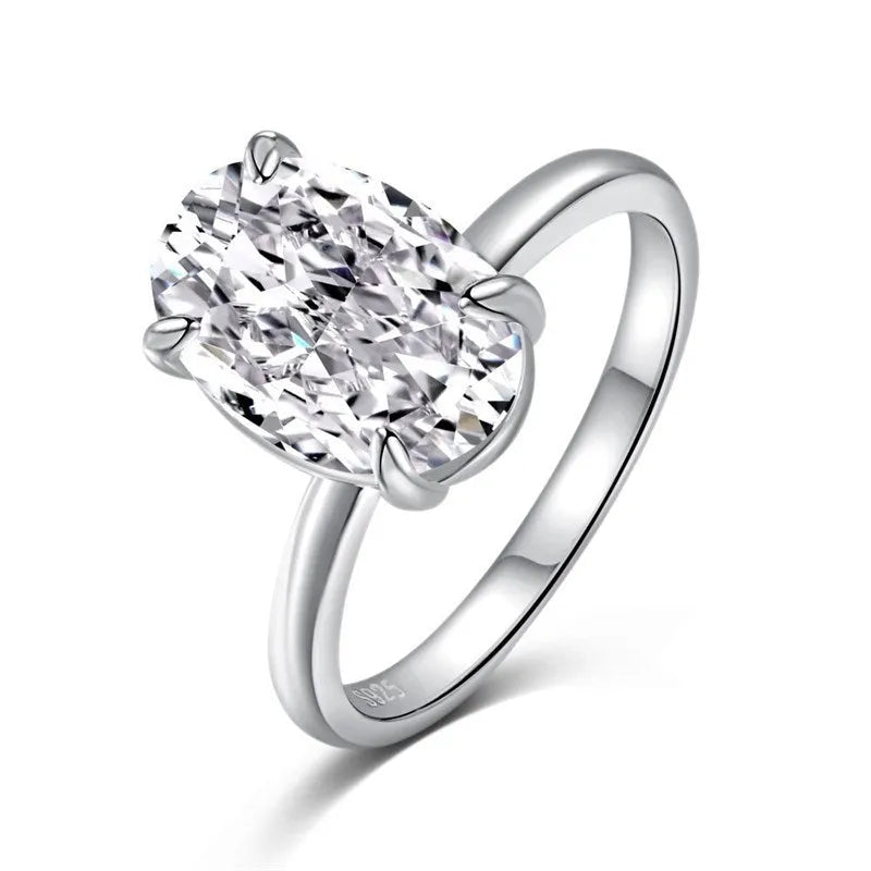 Oval 9 silver ring with four-claw setting holding 6x9mm hand-cut gemstone
