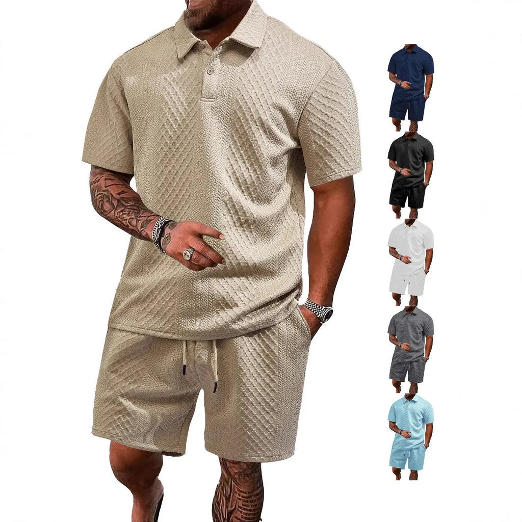 Men's patterned cloth casual suit set featuring a short sleeve polo shirt and trousers on a hanger.