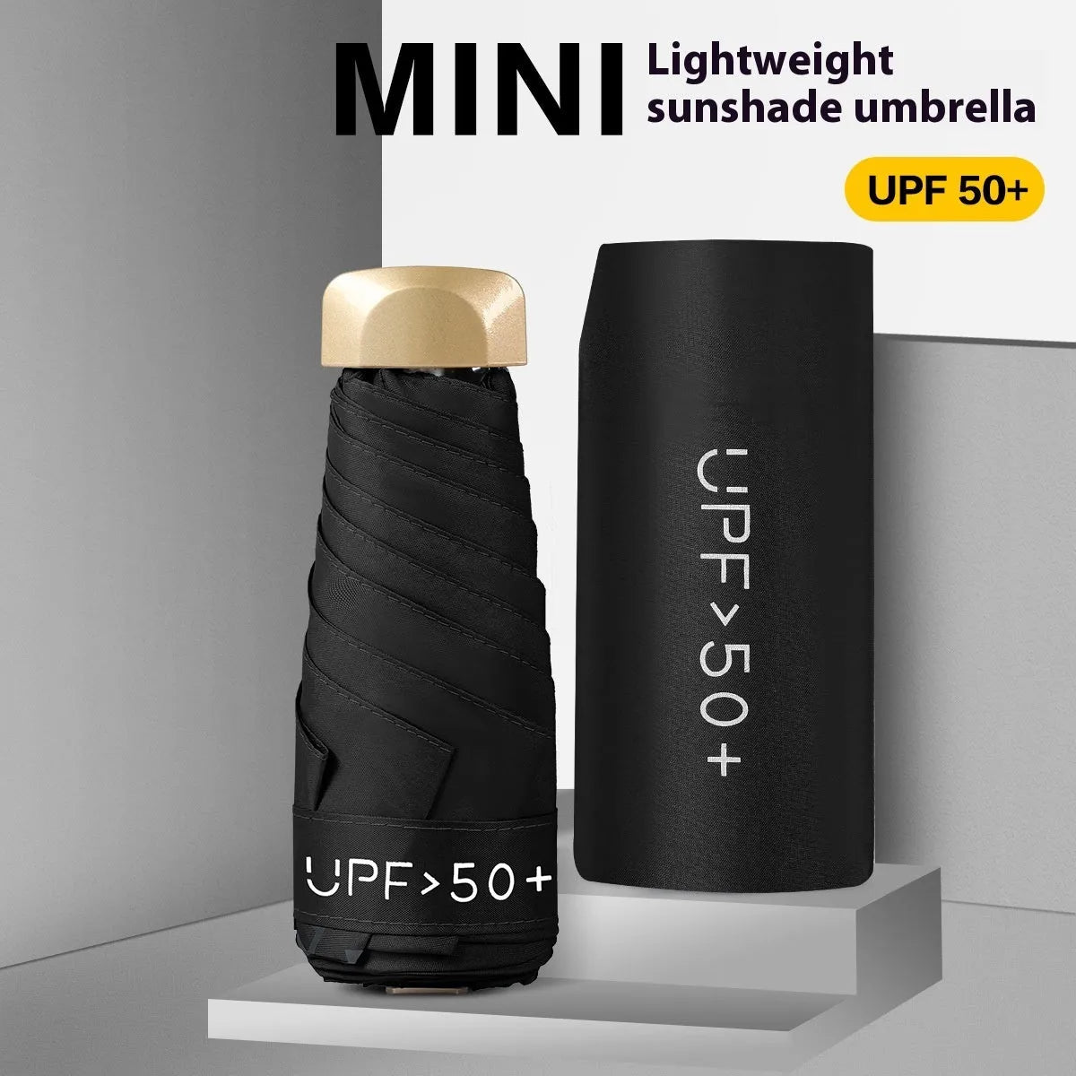 Closed five-fold mini pocket sun umbrella with a rubber handle, showing its compact size.