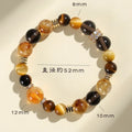 Yellow artificial crystal beaded bracelet with 10mm tower-shaped beads on wrist