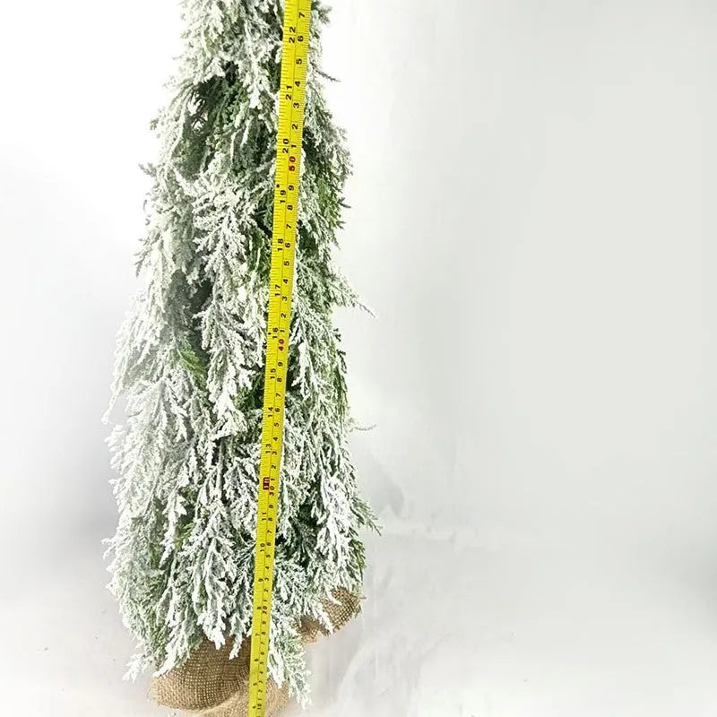 24 inch plastic Christmas tree with lights and PE snow decoration on desktop