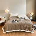 Polyester thermal flannel winter blanket in beige colour, laid flat showing its 180x200cm size and textured fabric.