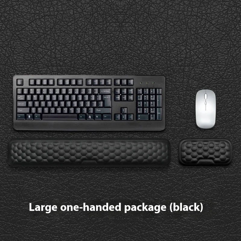 Memory foam mouse wrist rest pad with silicone base in black cloth cover option on desk