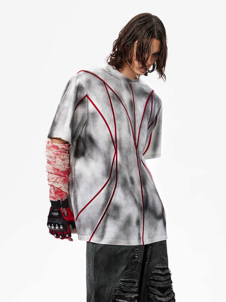 Short sleeve T-shirt with padded shoulders and three-dimensional patchwork design