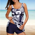 Blue women's printed split bikini swimsuit with sleeveless design on mannequin