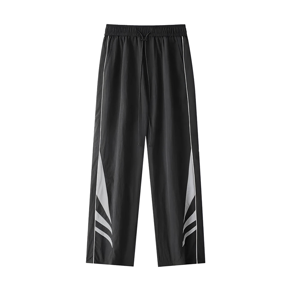 Men's straight leg summer sports trousers in grey, showing loose fit and button fly.