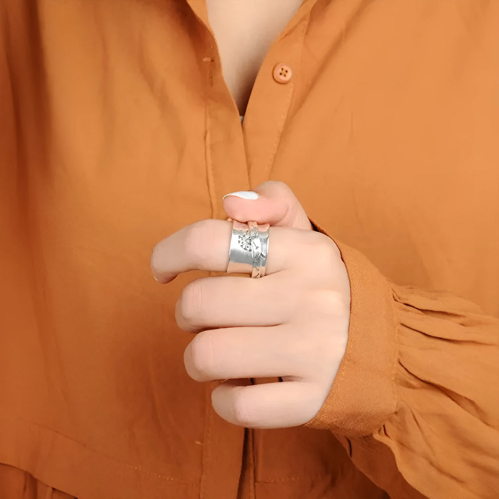 Silver rotatable flower ring with adjustable floral element and electroplated alloy construction