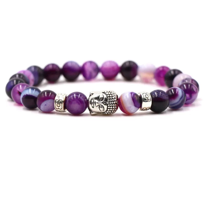 Tigereye stone Buddha head stretch bracelet with 8mm beads on a wrist.