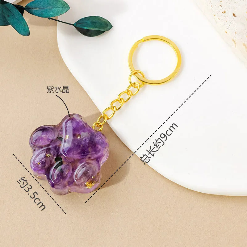 Natural crystal cat's paw keychain pendant charm in one of ten crystal types including pink crystal and amethyst.