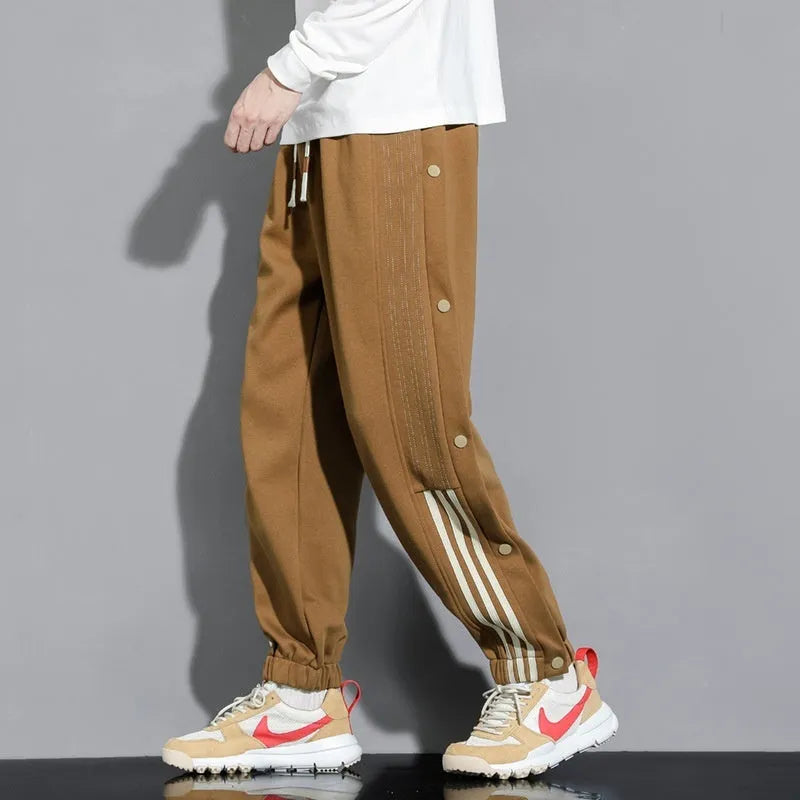 Men's loose fit cotton blend sports trousers with ankle tie fastenings and drawstring waist
