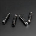 Four carbon fibre and metal car door handle decorative covers for direct replacement installation.