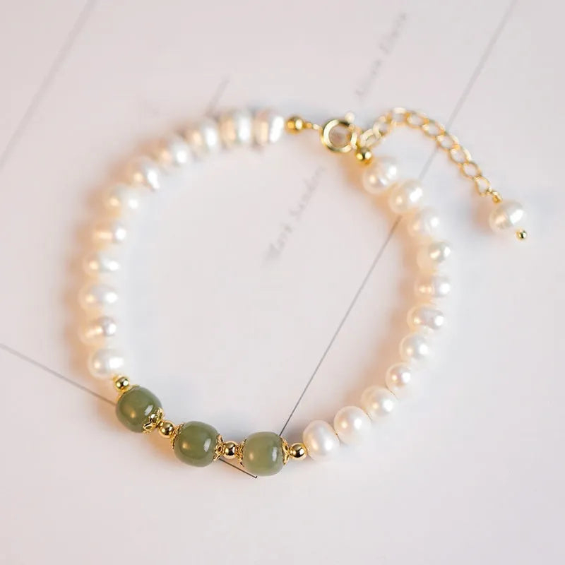 Korean style natural freshwater pearl bracelet with diamond-shaped beads in a Hetian jade electroplated finish.