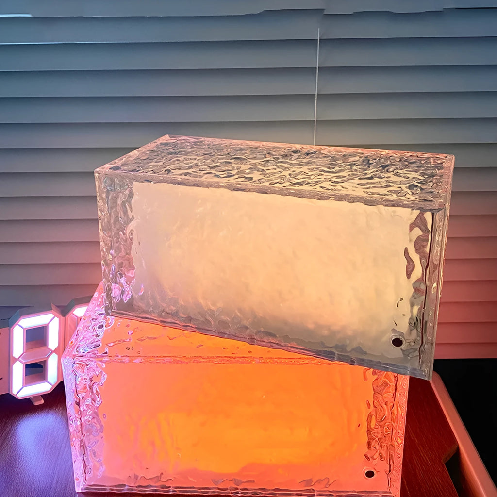 Small white acrylic cube night lamp with geometric design and coloured LED lighting
