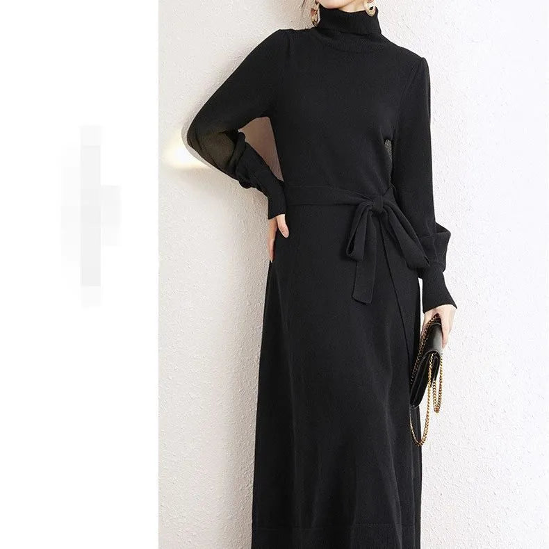 A rose red turtleneck knit dress with long sleeves, an elastic waist, and a loose mid-length skirt.