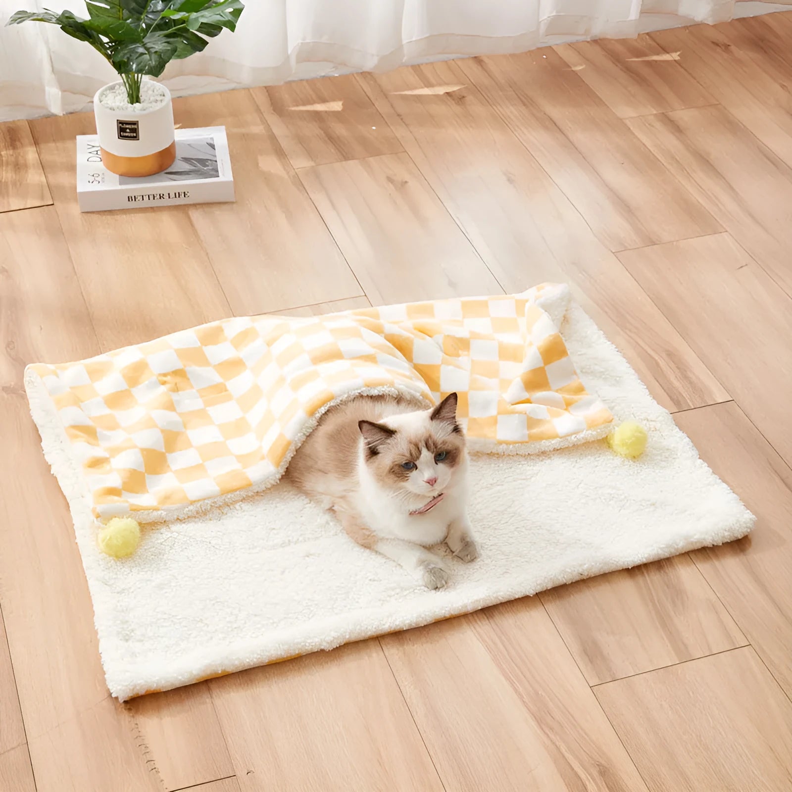 Plush cotton fleece pet blanket with plaid pattern and fur balls in green colour on couch