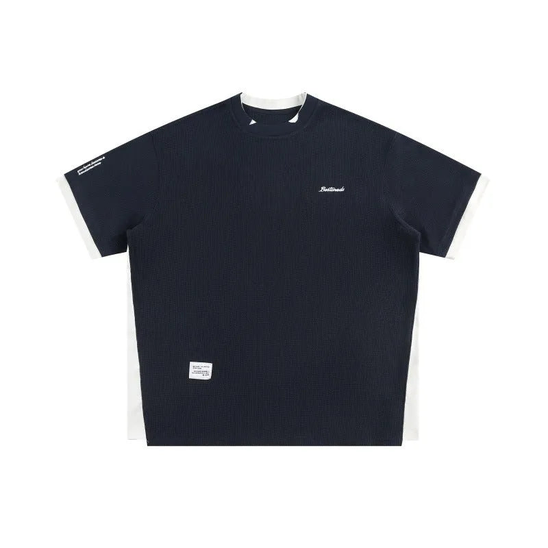 Retro alphabet embroidered loose waffle knit short-sleeved t-shirt in navy blue.