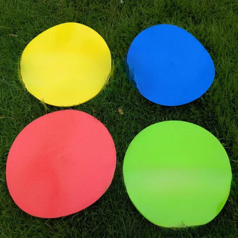 Soft yellow TPE football training landmark pad on grass, showing 23cm diameter.
