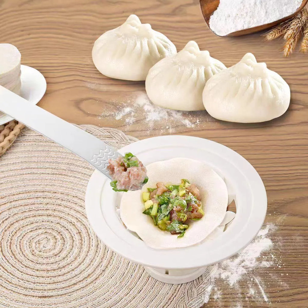 Set of four black plastic steamed bun moulds for shaping baozi and dumplings