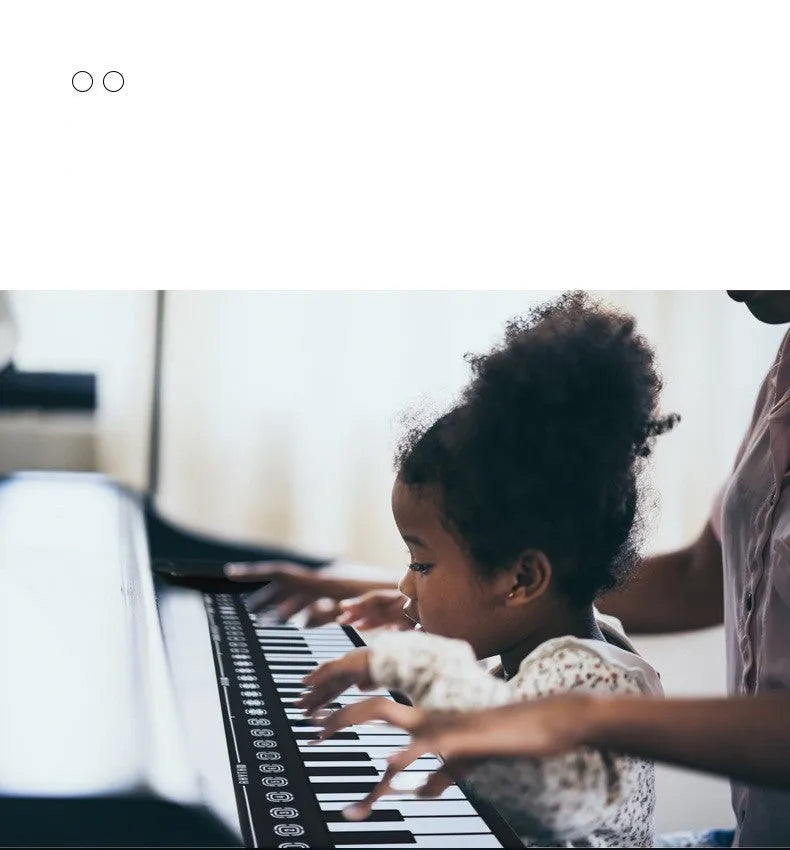 Portable 49-key folding electronic keyboard in pearl white, shown both unfolded for playing and folded for storage.