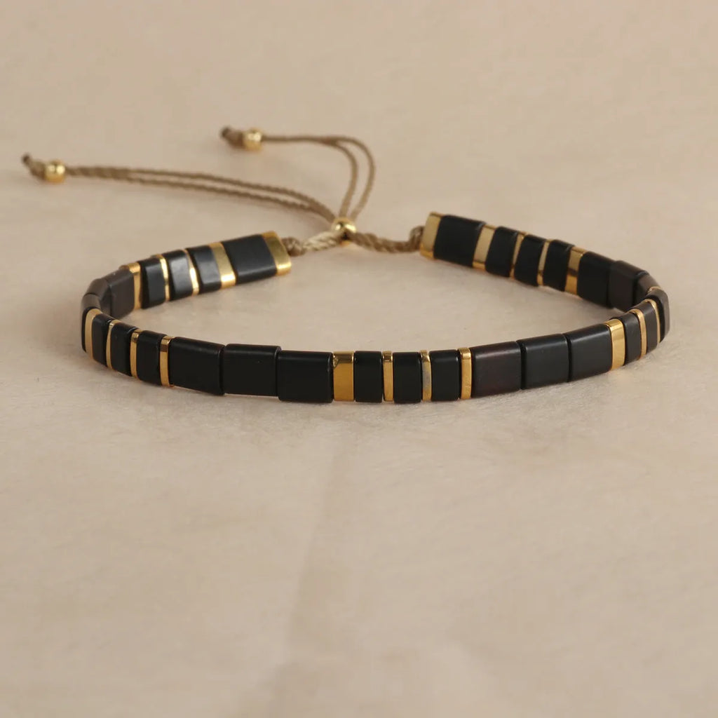 Glass and coloured glaze beaded bracelet with geometric round beads in five colour options