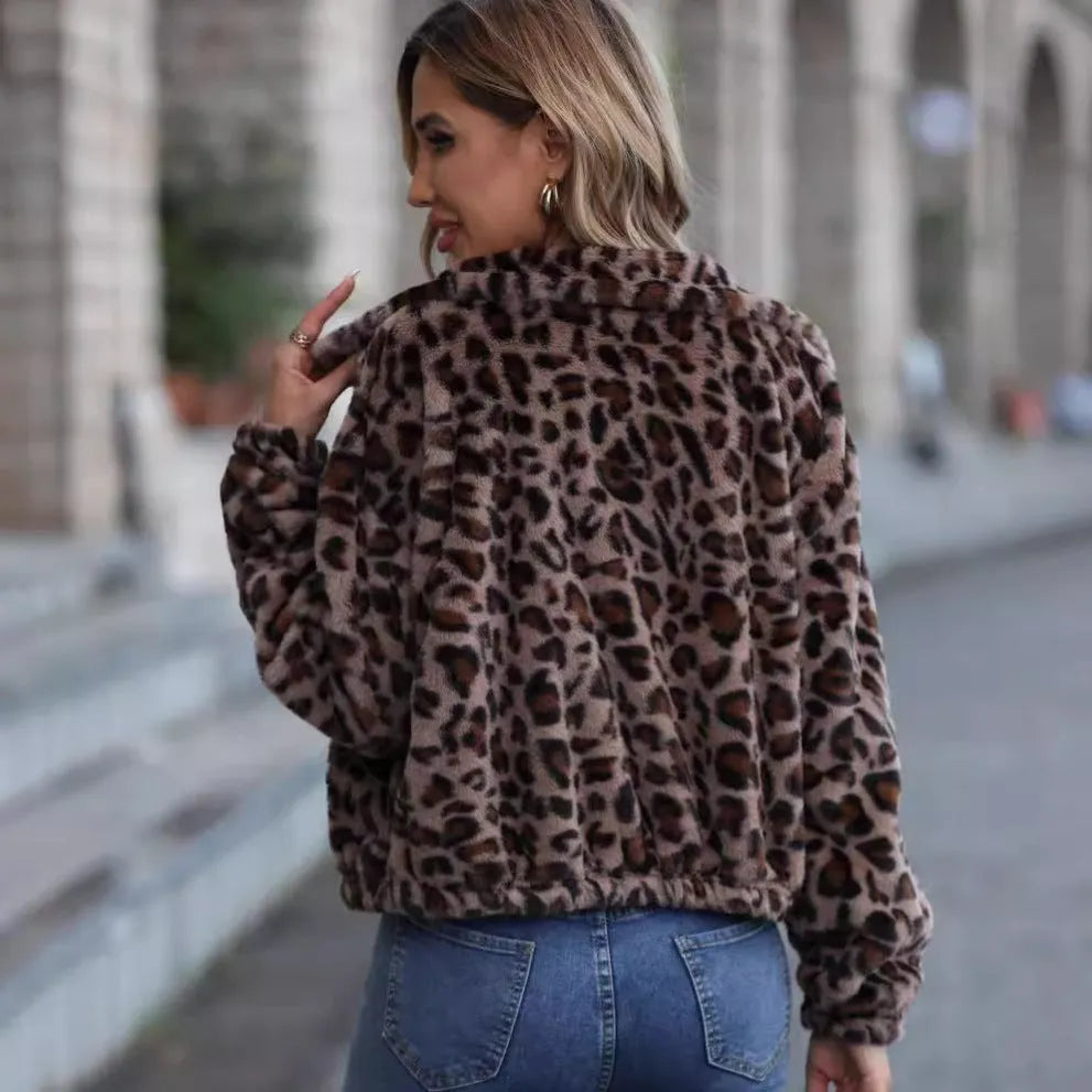 Women's loose leopard print plush coat with zipper and raglan sleeves on a hanger