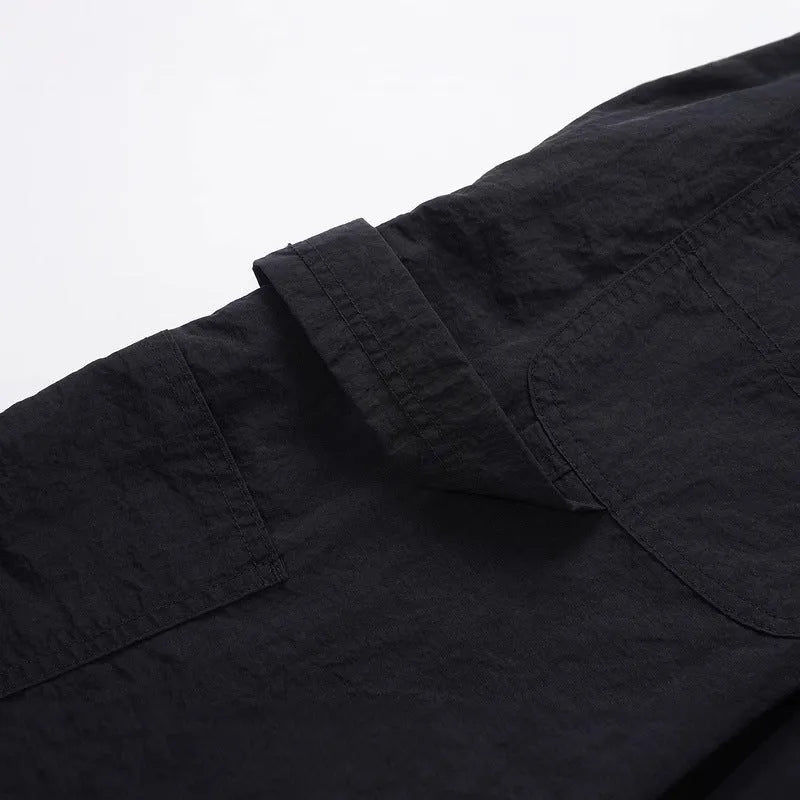 Black paratrooper trousers with elastic drawstring waist and three-dimensional cutting in baggy style