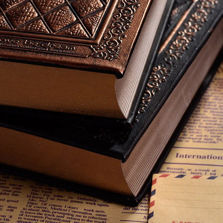 Embossed faux leather notebook with three-dimensional patterns in bronze or black gold colour