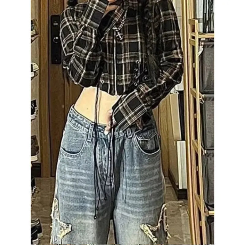 Blue wide-leg high-waist denim trousers with straight leg design laid flat