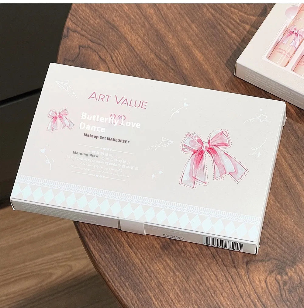 Butterfly Box cosmetics set showing four matte lip muds, pink powder blusher and necklace