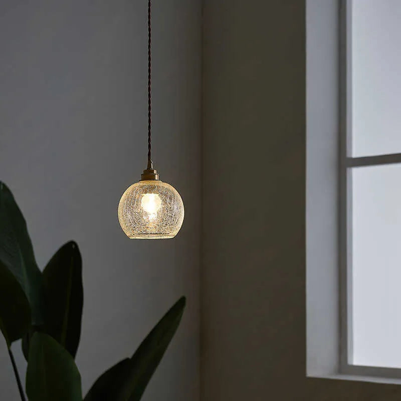 Brass chandelier with glass ball shades measuring 17.5cm wide, showing electroplated copper construction