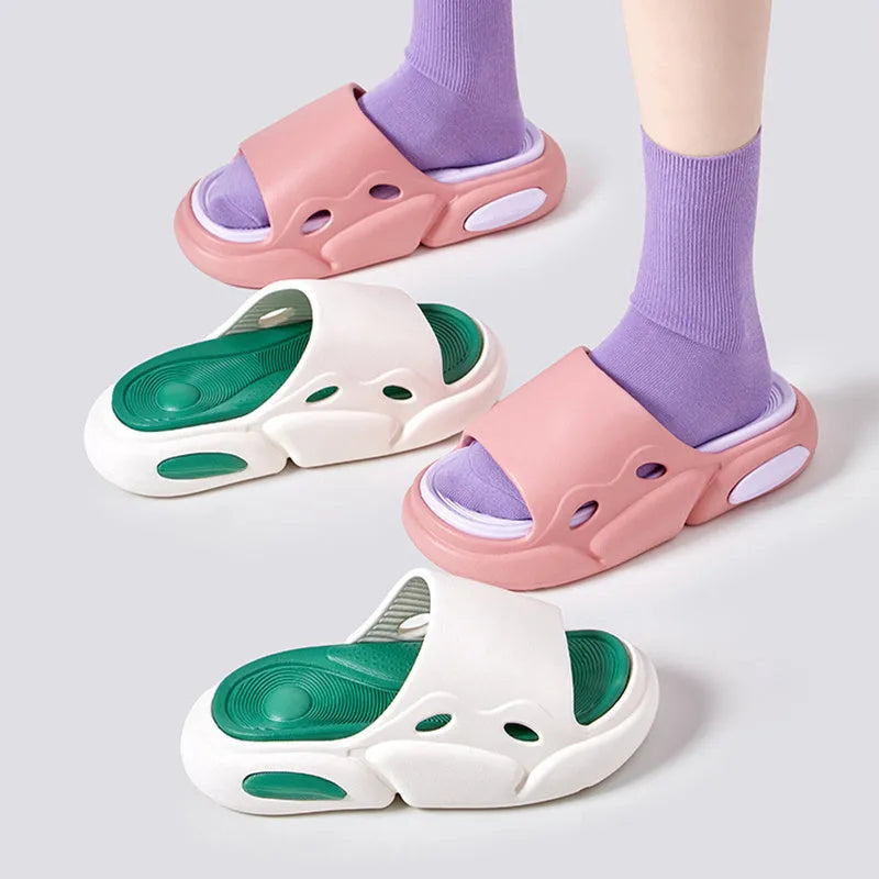 Two-colour EVA couples slippers with thick sole and leather lining in pink purple, shown from the side.