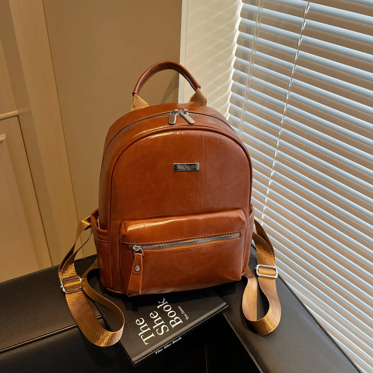 PU leather ladies travel backpack in urban simplicity style with sandwich pocket and polyester lining