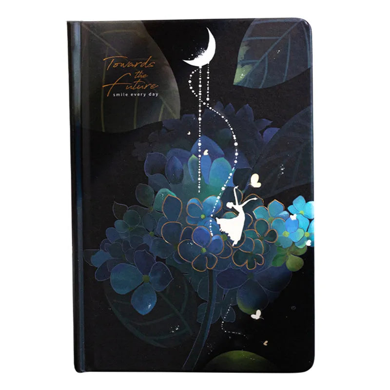 A5 notebook with luminous purple cover open to show pages filled with colour illustrations.
