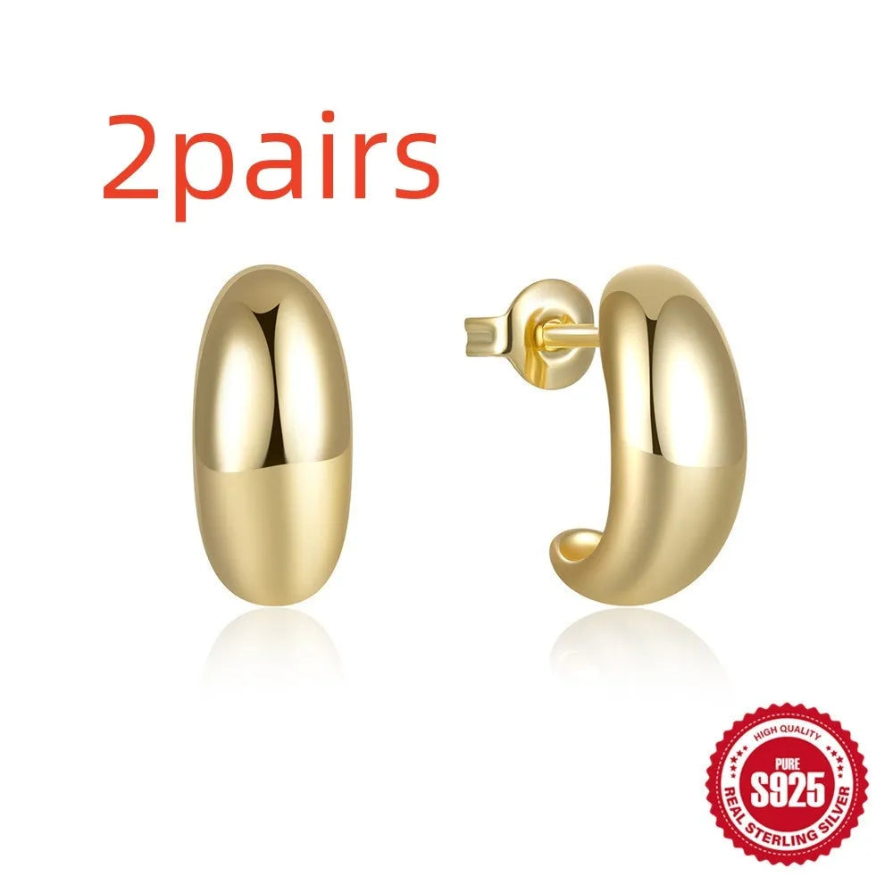 S925 sterling silver C-shaped ringstud earring with glossy electroplated finish in gold or white gold.