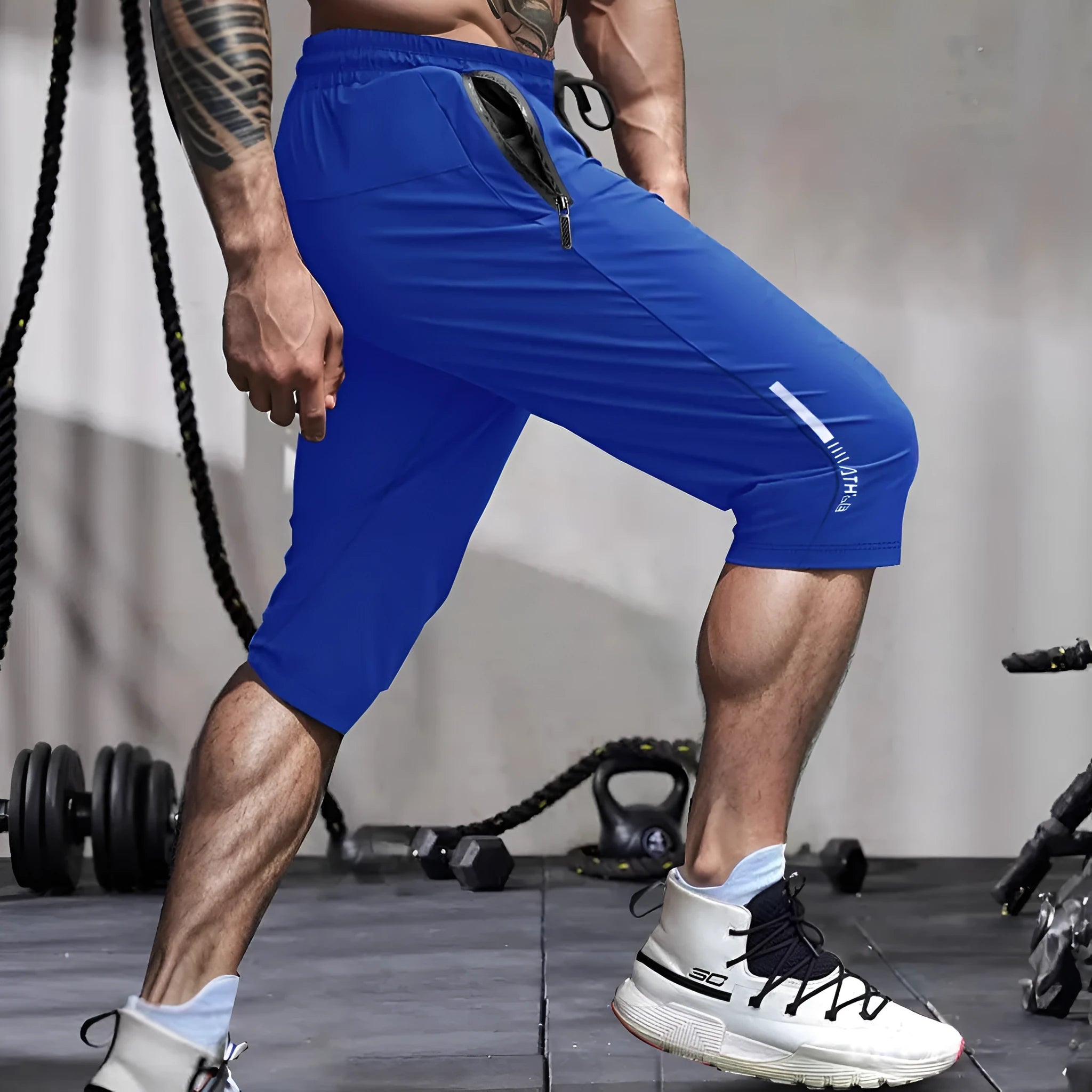 Men's cropped quick-dry sports casual pants in nylon, shown in blue colour.