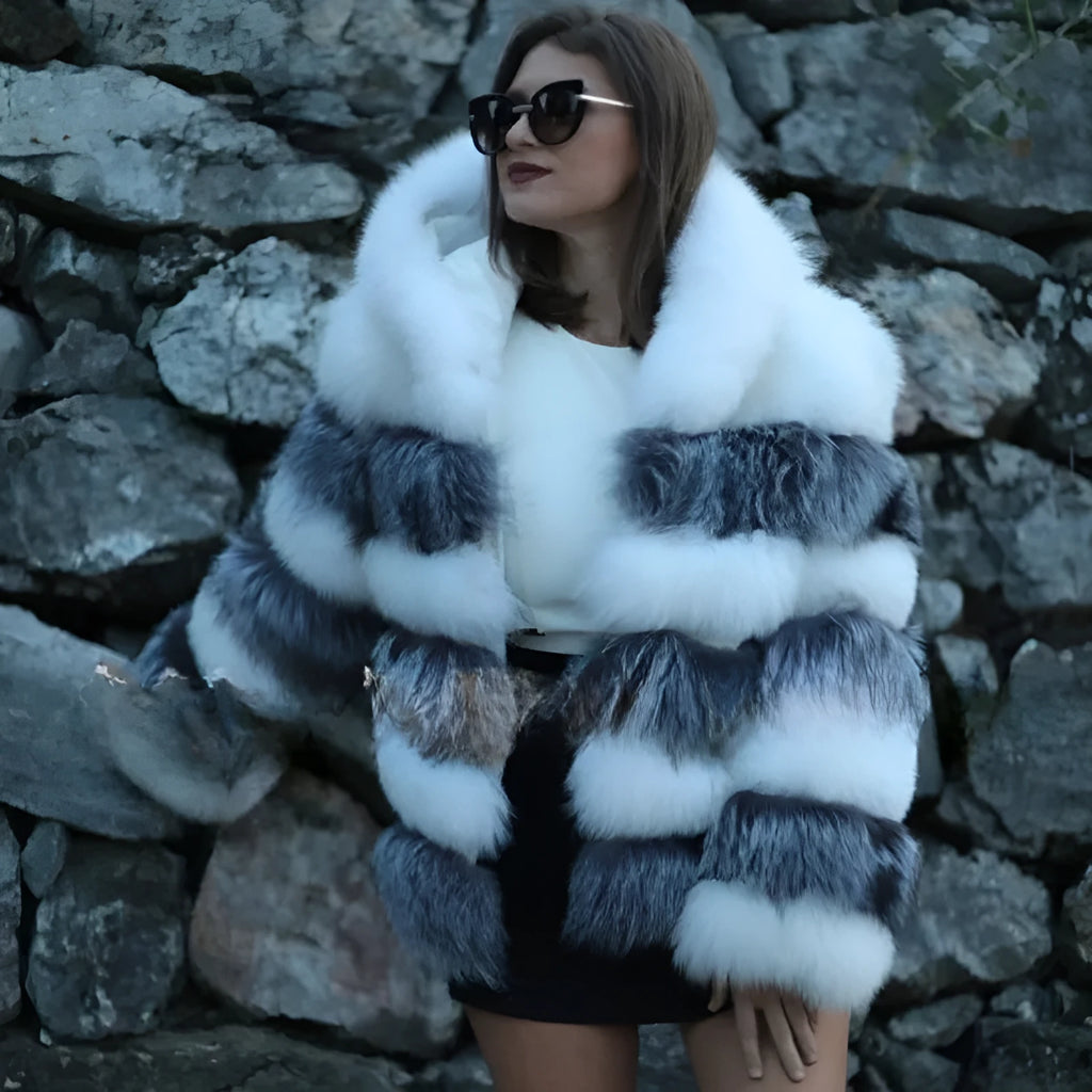 Women's loose artificial fur coat with hood in brown colour on mannequin