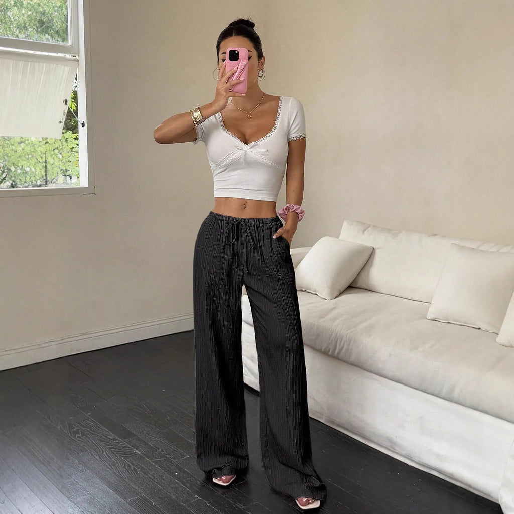 Women's black wide-leg trousers with lace-up waist detail