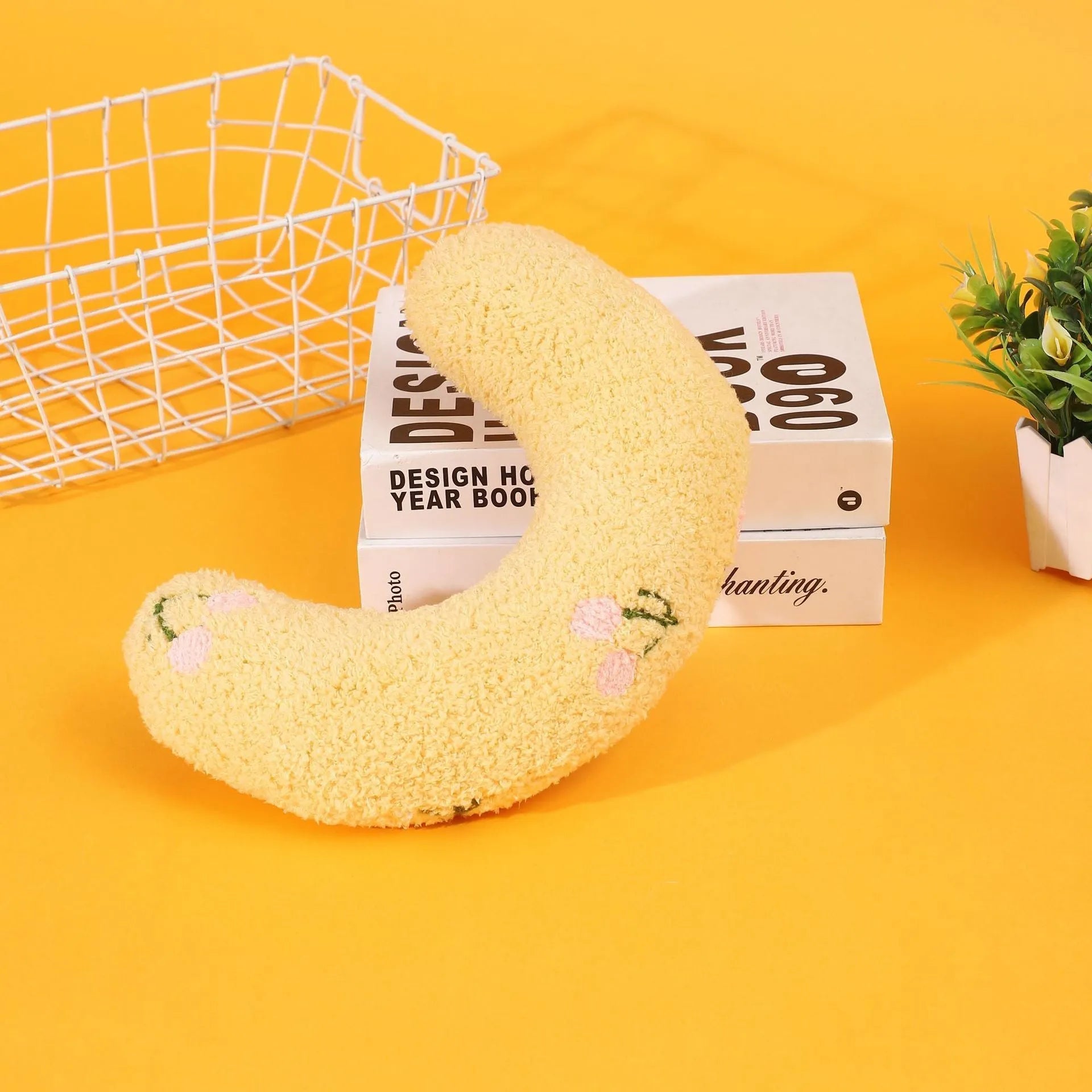 Blue half moon U-shaped cat pillow with cartoon dog and cat design for pet crates.