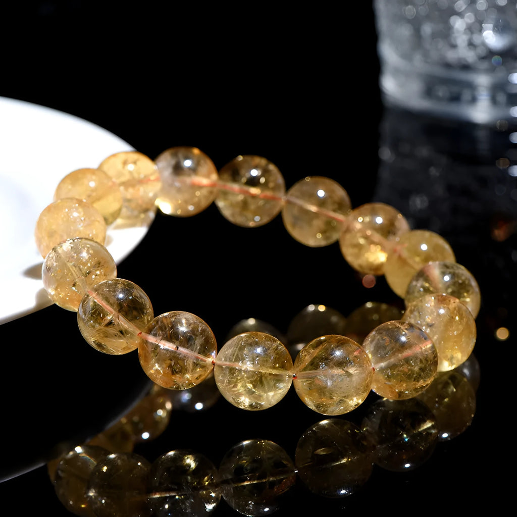 Natural yellow citrine gemstone bracelet showing single circle and three circle bead designs on a wrist.