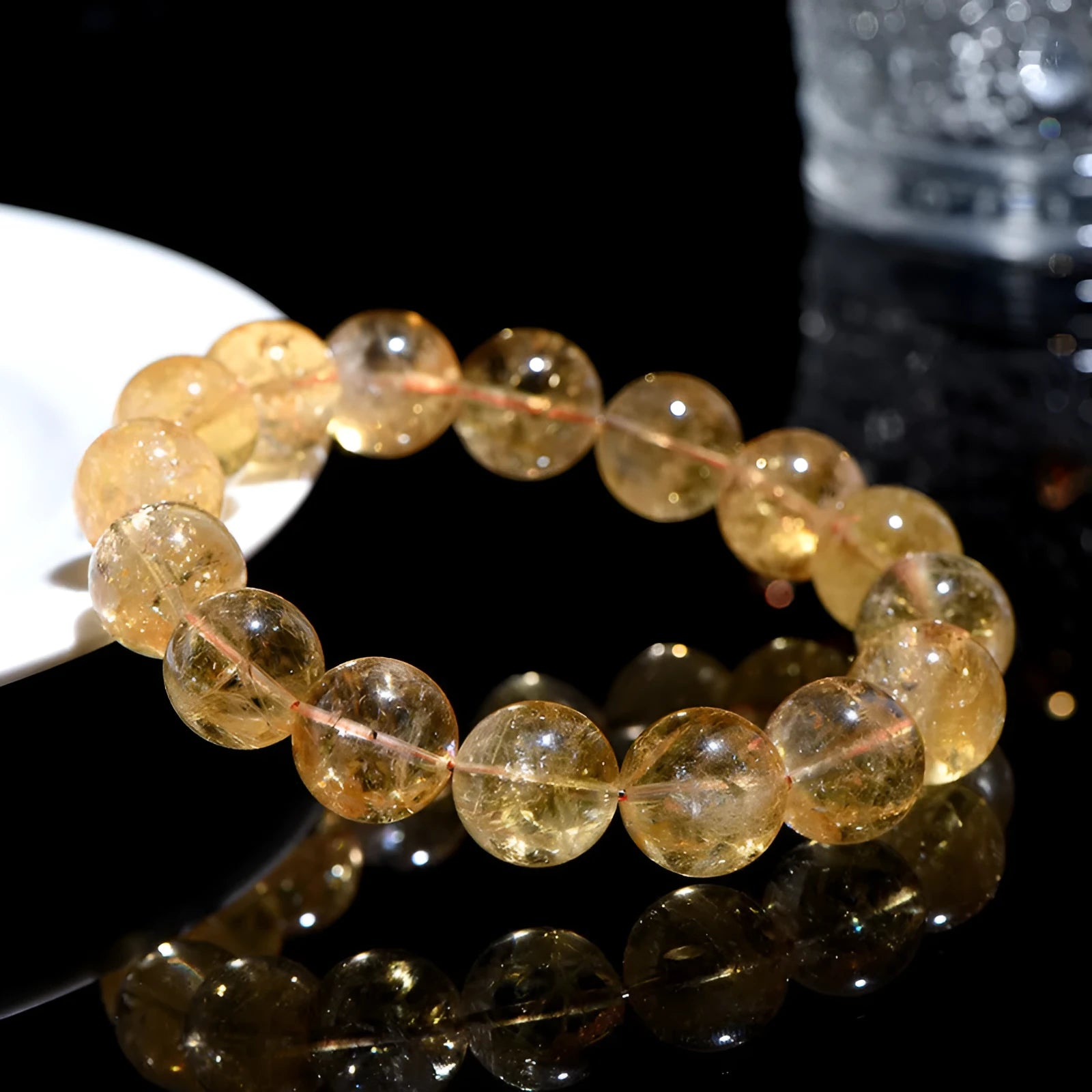 Natural yellow citrine gemstone bracelet showing single circle and three circle bead designs on a wrist.