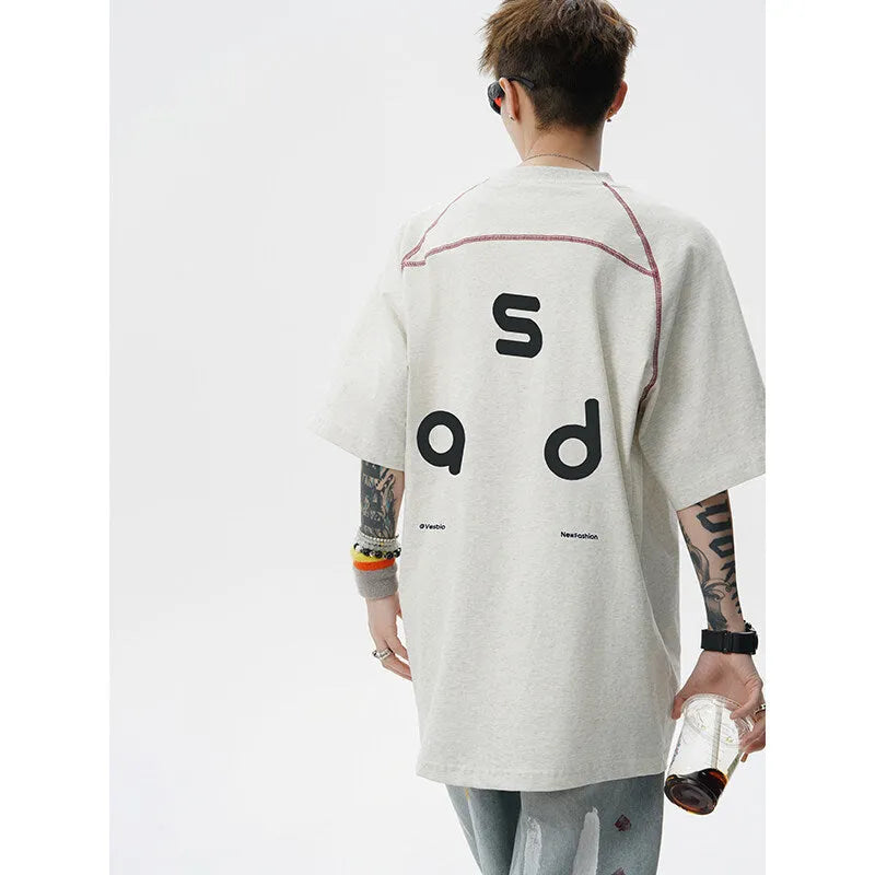 Cotton loose fit t-shirt with letter print design on front, showing round neck and short sleeves