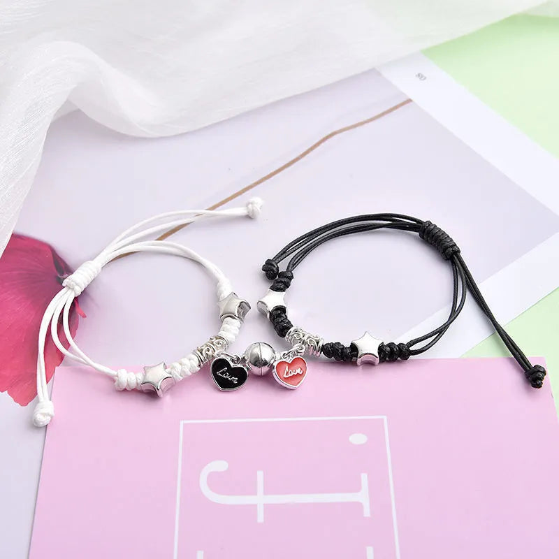 Magnetic couple bracelet pair with alloy electroplating in various designs including clover and crown patterns