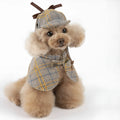 Camel-coloured cotton detective suit cloak for a small dog on a neutral background.