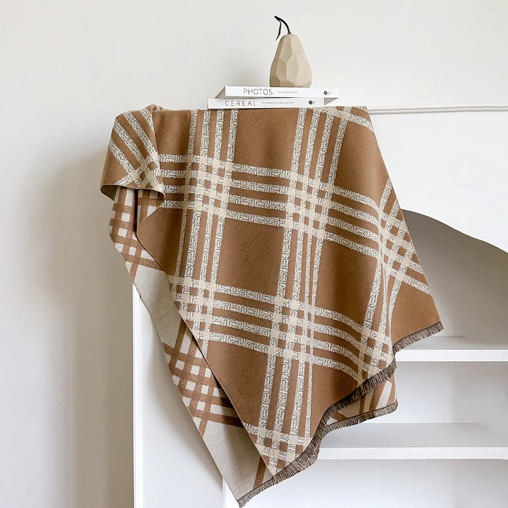Cashmere-like scarf with tassel detailing in brown colour showing mid-length design