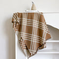 Cashmere-like scarf with tassel detailing in brown colour showing mid-length design