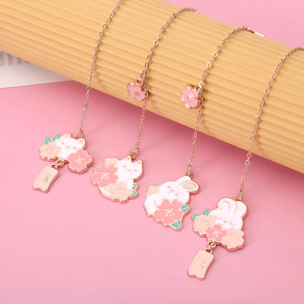 Metal pendant bookmark with cherry blossom cartoon cat design and matching book holder