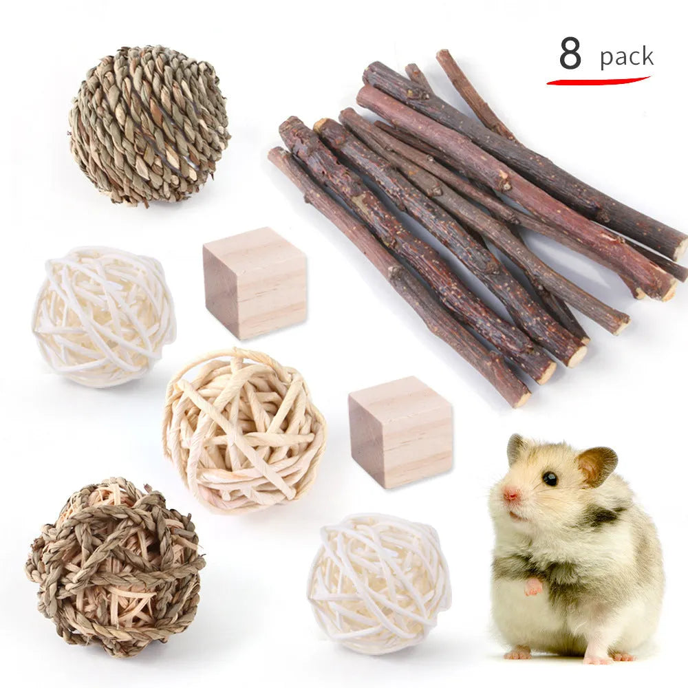 Natural wooden chewing toy set for small animals including straw mats, woven balls and plant-based components