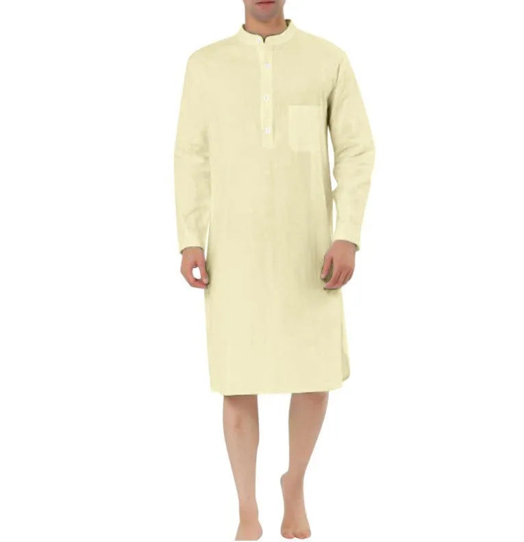 Man wearing a dark blue cotton robe shirt with button front and chest pocket